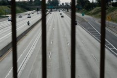 A view of rush hour on the 405 freeway from the Orange Avenue overpass in Long Beach Tuesday, March 31, 2020. Photograph by Dillon Hulse.