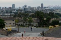 A man rides a bike during the "safer at home" order at the corner of Cherry Avenue and Burnett Street near Hilltop Park in Signal Hill Tuesday, March 31, 2020. Photograph by Dillon Hulse.