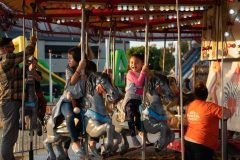 10/09/2019 – LONG BEACH, CALIF: Two girls experience different reactions on the carousel at Pa's Pumpkin Patch. Photograph by Dillon Hulse