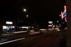 12/03/19 – LONG BEACH, CALIF: Cars hurry to and fro outside of Joe Jost's on Anaheim as another Long Beach day comes and goes. Photograph by Dillon Hulse.