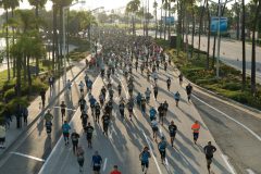 10/13/2019 – LONG BEACH, CALIF: Runners participating in the Long Beach Half Marathon pour down Shoreline Drive early Sunday morning. Photograph by Dillon Hulse.