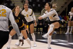 12/04/2019 – LONG BEACH, CALIF: Sophomore Carly Hill receives for The Beach as the action of the fourth set nears its climax. Dillon Hulse.