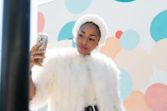 Ranitra Lavon, @missgolden_lady on Instagram, takes a selfie at the end of her Easter-themed photoshoot in Long Beach Sunday, March 8, 2020. Photograph by Dillon Hulse.